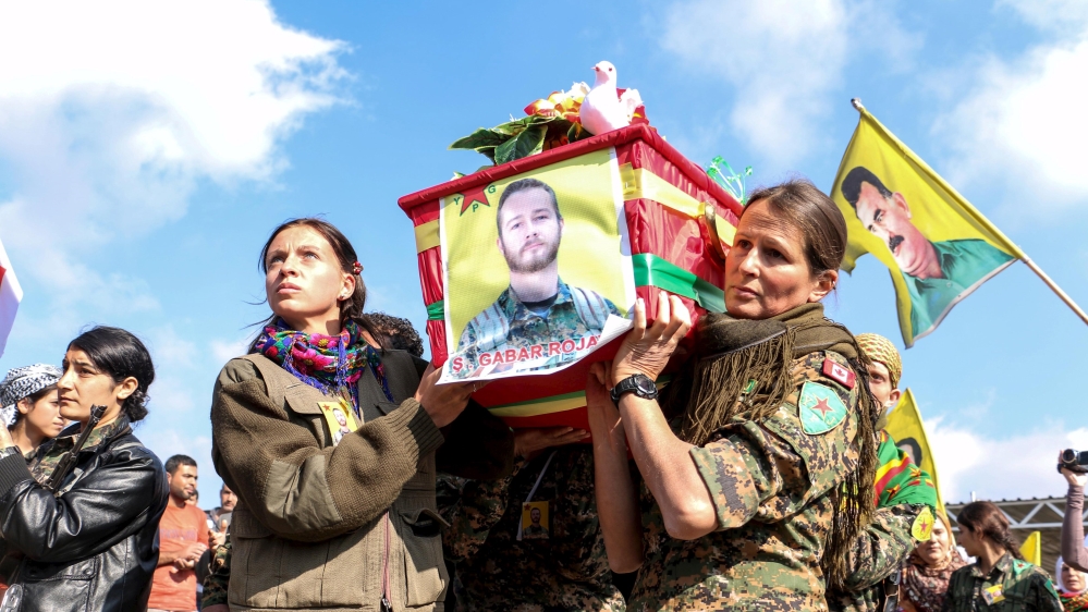 Kurdish People''s Protection Units fighters carry the coffin of fellow fighter Gallagher, who died on November 4 in battle with Islamic State fighters, during his funeral in Hasaka, Syria