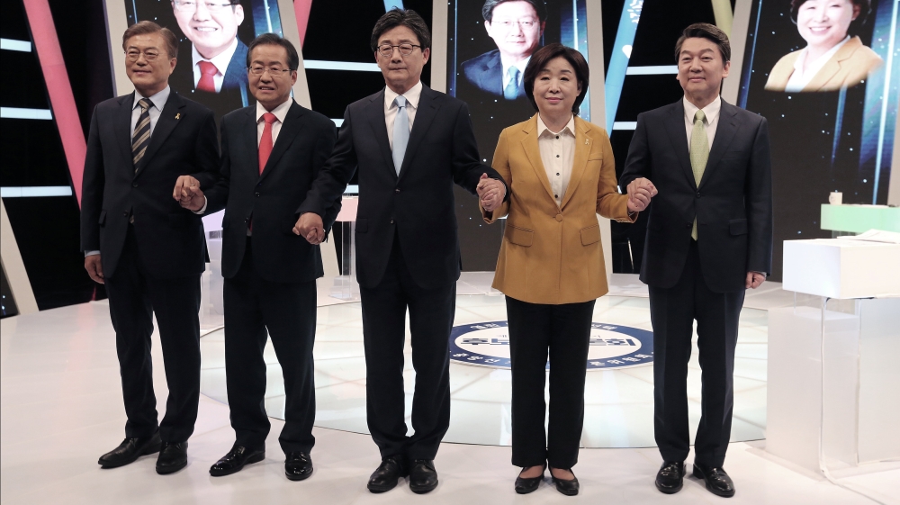 South Korean presidential election candidates pose before a debate in Seoul