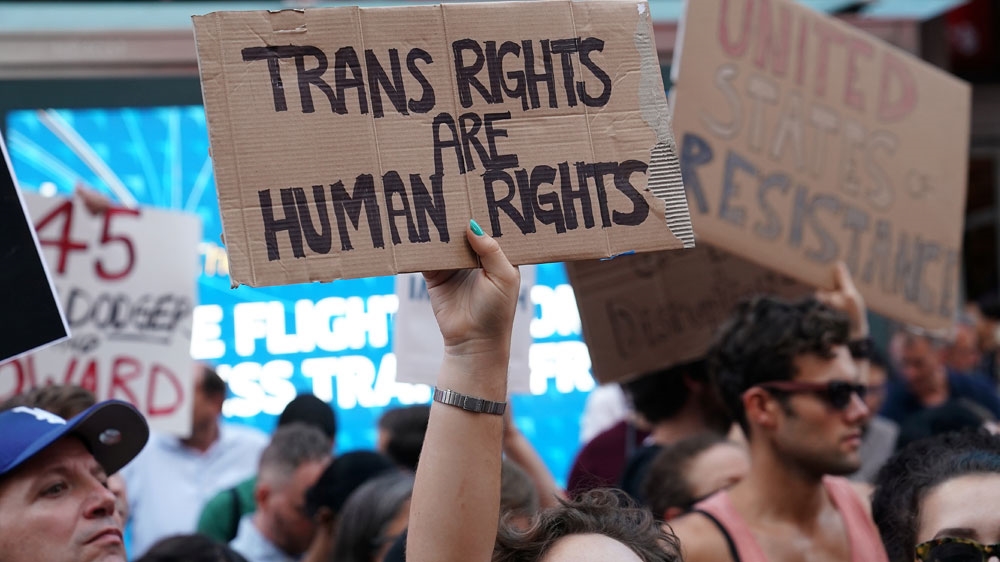People protest against Trump’s announcement that he plans to reinstate a ban on transgender individuals from serving in any capacity in the US military in 2017