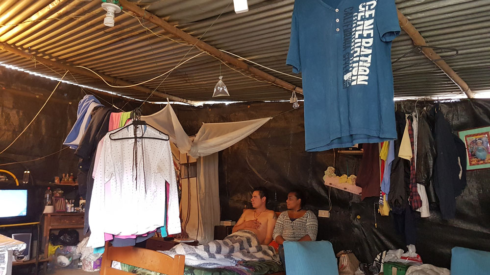 Rosa Fierro and her partner Juan Carlos Orjuela are both victims of Colombia's long-running civil war. They fled their homes to escape being recruited by paramilitaries. They complain about their cramped living conditions in Soacha but say its better than living under the constant threat of attack by guerrillas in their home villages [Dimitri O'Donnell/Al Jazeera]