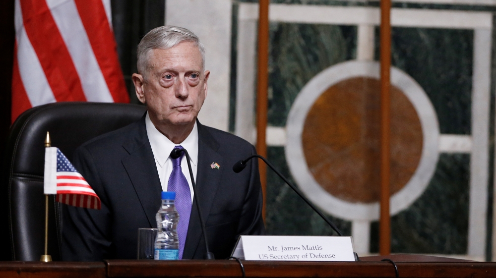 Mattis listens to question during joint news conference in New Delhi