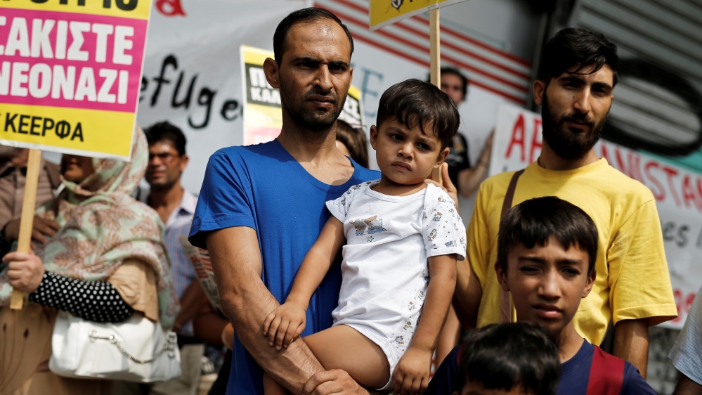 Afghan migrants living in Greece take part in a protest demanding rights as refugees fleeing war, outside the Migration Ministry in Athens