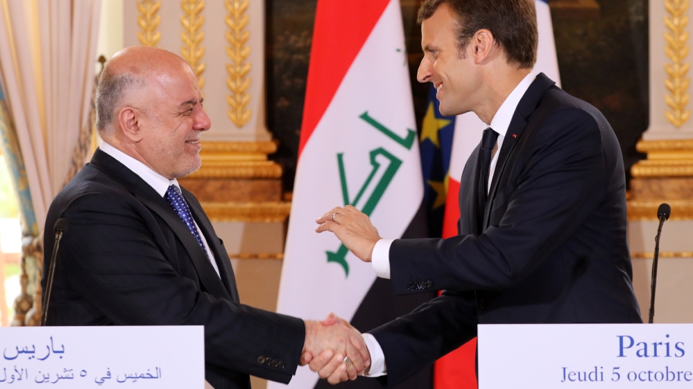 French President Emmanuel Macron and Iraqi Prime minister Haider Al-Abadi attend a joint news conference at the Elysee Palace in Paris