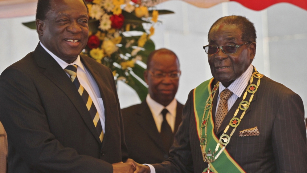 President Mugabe greets Vice President Mnangagwa as he arrives for Zimbabwe''s Heroes Day commemorations in Harare