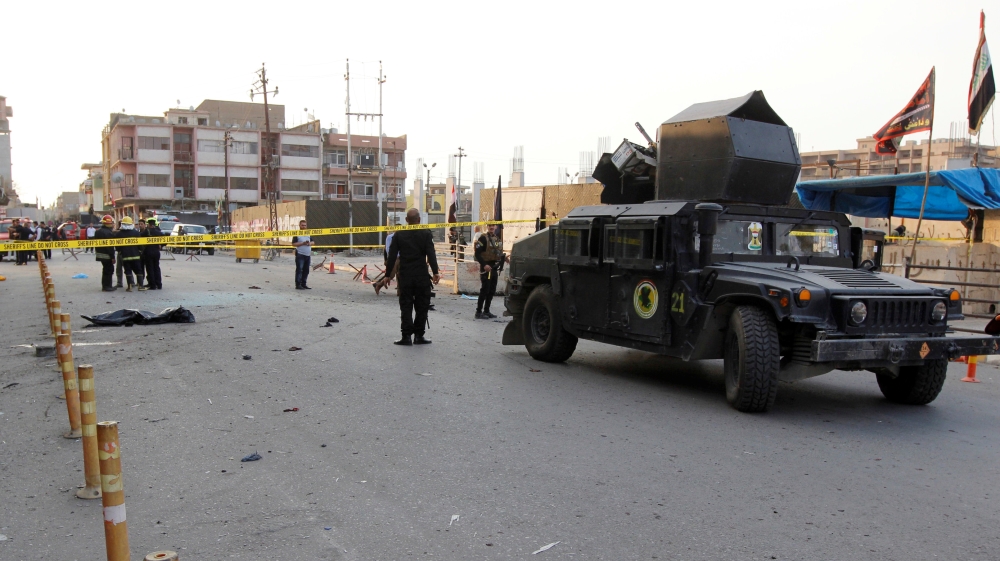 A military vehicle of Iraqi security forces is seen at the site of a suicide bomb attack in Kirkuk