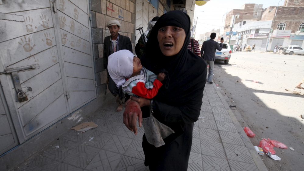 DO NOT USE: Injured Yemeni woman reacts after an air strike