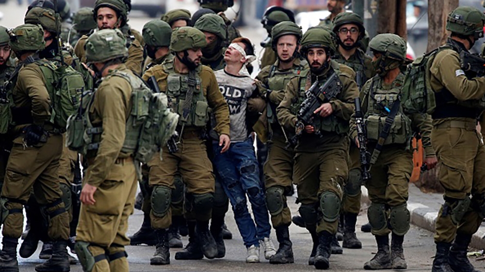Fawzi al-Junaidi has been charged with throwing stones [Wisam Hashlamoun/Anadolu Agency/Getty Images]