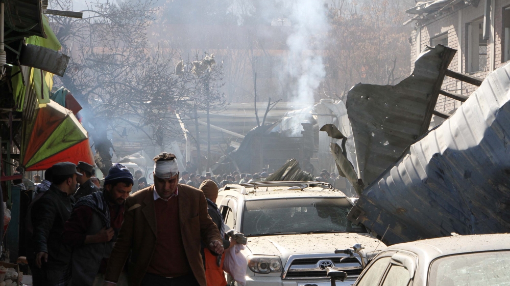 Attackers blew up an explosives-packed ambulance near an interior ministry building [Anadolu/Haroon Sabawoon]