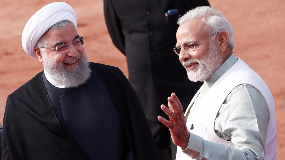 Iranian President Hassan Rouhani was accorded a warm welcome [Adnan Abidi/Reuters]