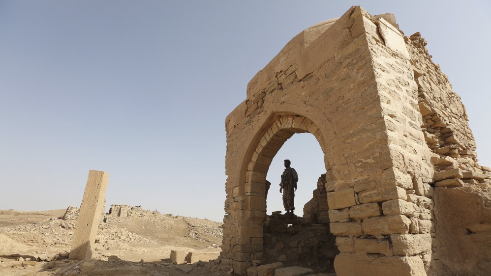 A man stands inside a monument at the historical town of Baraqish in Yemen''s al-Jawf province after it was taken over by pro-government forces from Houthi fighters