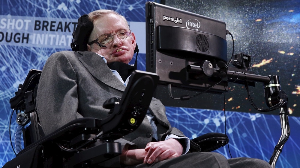 Hawking sits on stage during an announcement of the Breakthrough Starshot initiative with investor Yuri Milner in New York in 2016