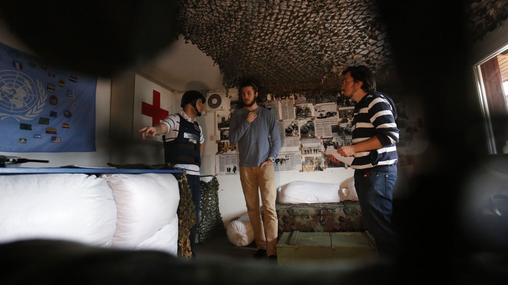 Kurbasic greets his guests from behind a sandbag barrier, which functions as a reception desk [AP Photo/Amel Emric]