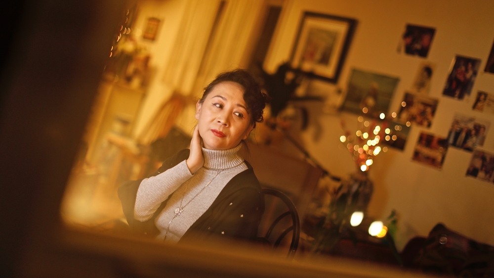 Following death threats by people claiming to be Chinese agents, Sheng Xue says she's often had vehicles with suspicious-looking men inside park in front of her Toronto home at night. [Al Jazeera]