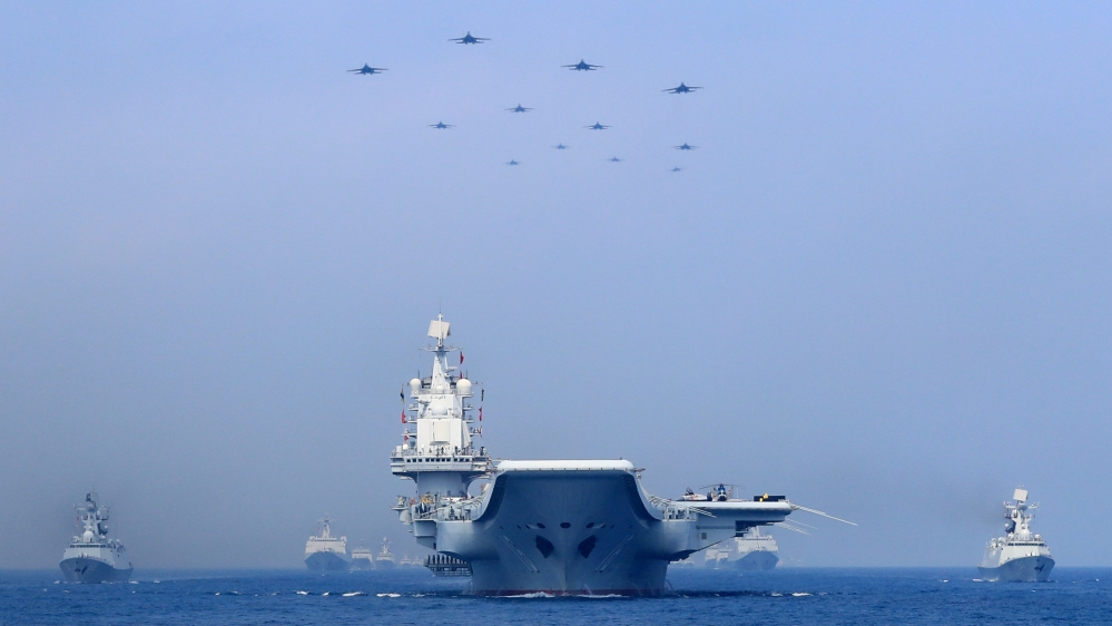 Warships and fighter jets of Chinese People''s Liberation Army (PLA) Navy take part in a military display in the South China Sea