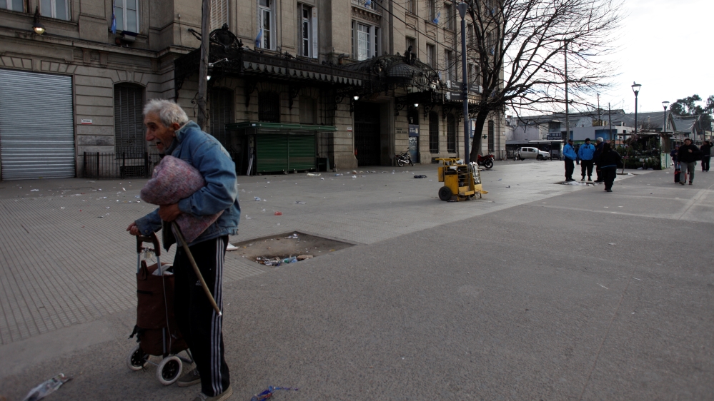 A man walks outside Retiro train terminal during a 24-hour national strike in Buenos Aires