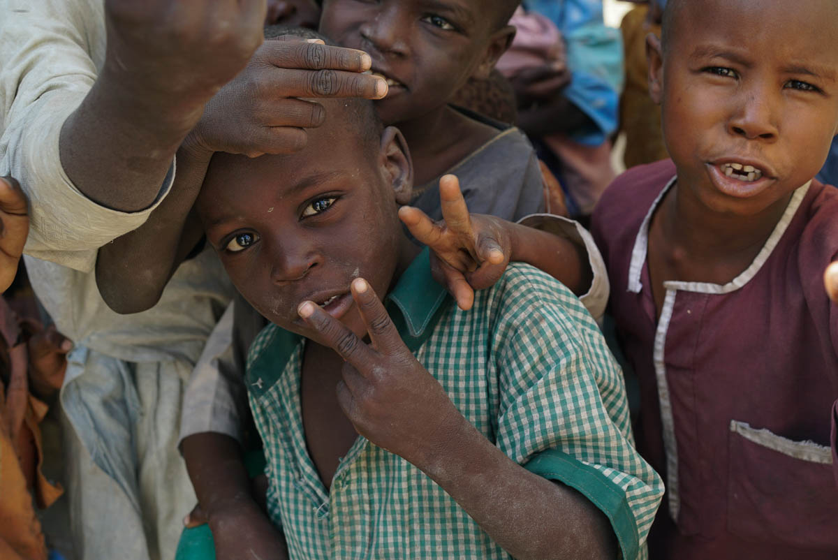A group of young Nigerian boys living in NYSC IDP camp, named for its previous function as an orientation camp for Nigeria’s Youth Service Corps (NYSC), in Maiduguri, Nigeria. More than half of IDPs
