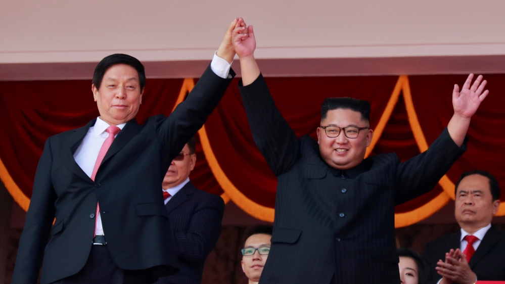 North Korean leader Kim Jong Un and China''s Li Zhanshu