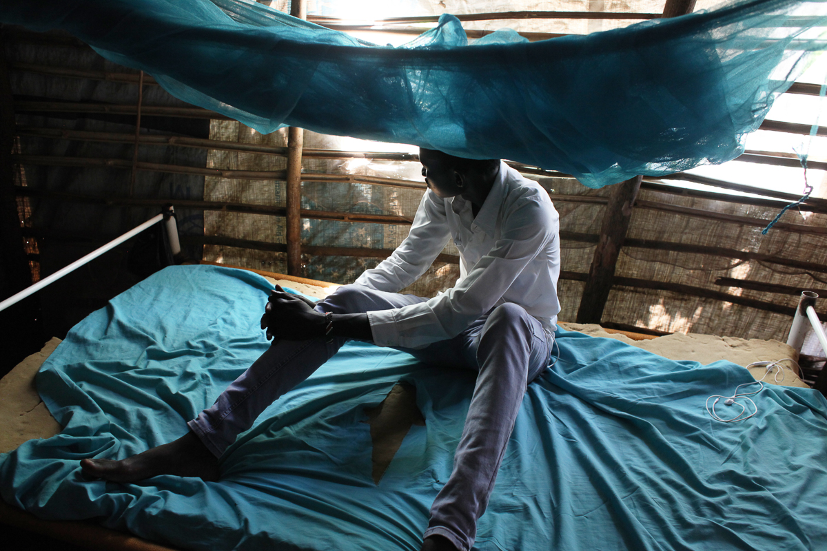 A 18 years old young man who was formerly associated with an armed group is posing for a photo in his home in the POC in Juba. Originally from Bentiu town, he fled in December 2013 when the conflict b