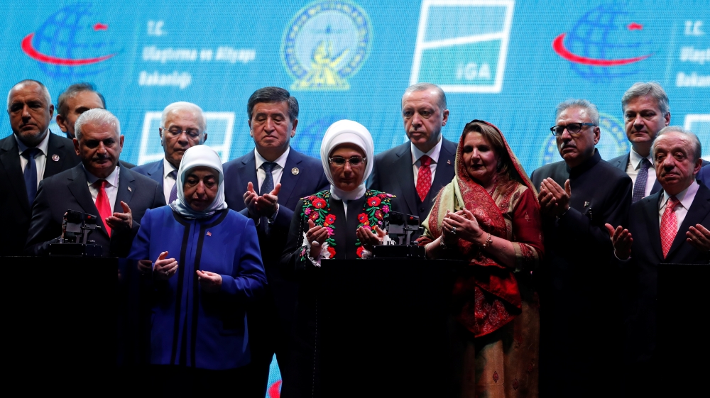 Turkey''s President Erdogan, his wife Emine and officials pray on the stage during the official opening ceremony of Istanbul''s new airport, in Istanbul