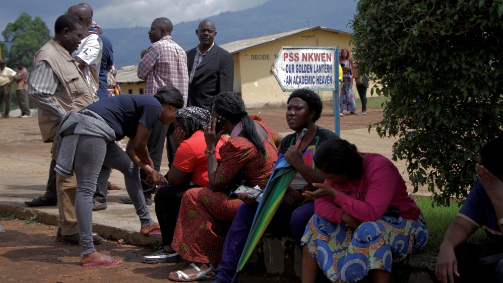 Parents await for news of their children at a school where 79 pupils were kidnapped in Bamenda