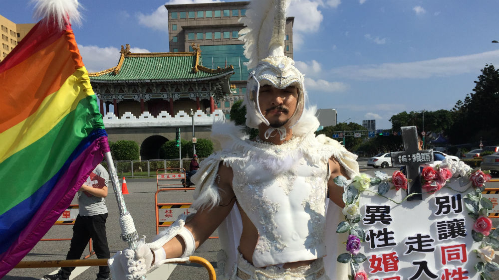 A marriage equality campaigner rallies in Taipei on November 18 [Adam Bemma/Al Jazeera]