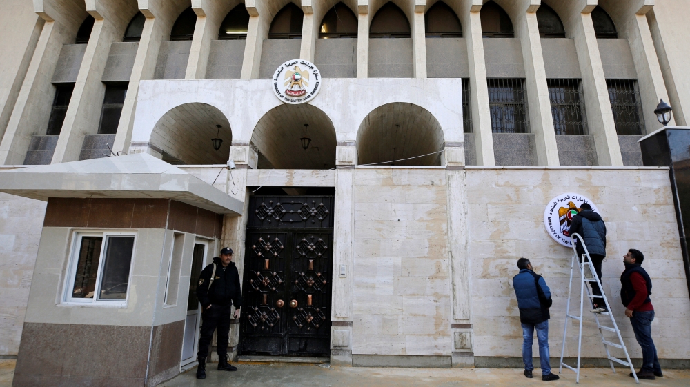 A security guard stands in front of the United Arab Emirates embassy in Damascus during its reopening