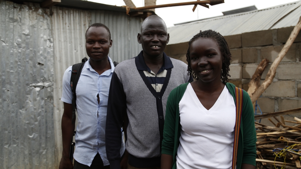 Ray Okech (left) and Maura Ajak posing with the character Kim Bany from their short VR film “Living With Disability” in South Sudan.