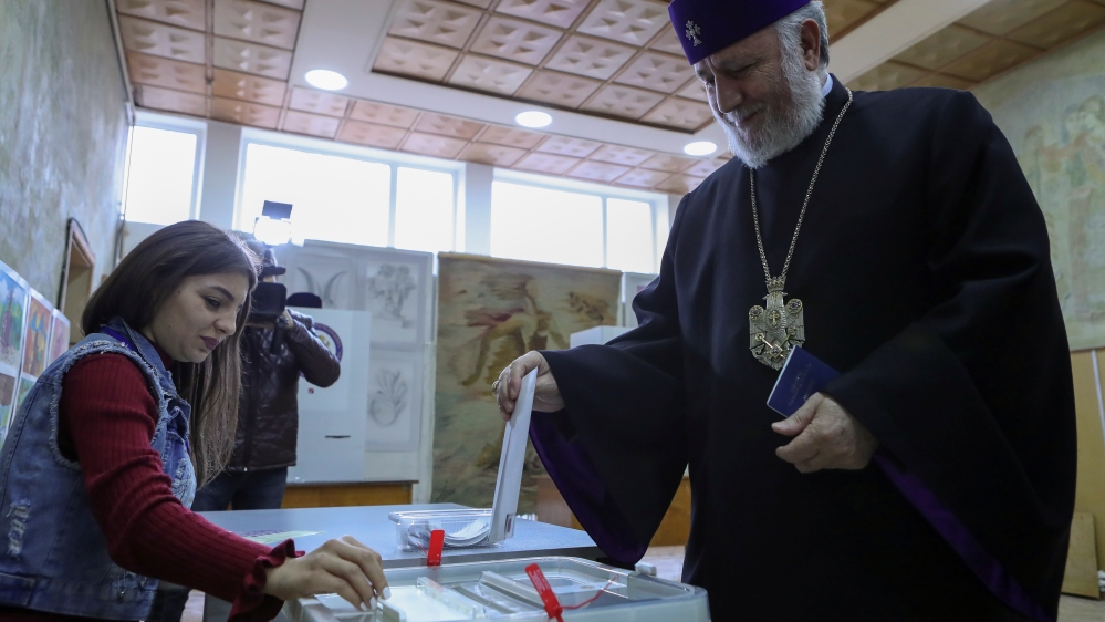 Catholicos of All Armenians Karekin II casts his ballot during an early parliamentary election in the town of Vagharshapat