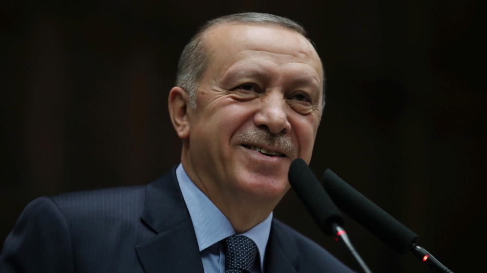 Turkish President Tayyip Erdogan addresses members of parliament from his ruling AK Party during a meeting at the Turkish parliament in Ankara