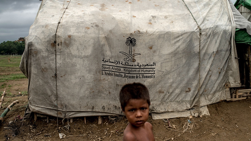 Myanmar''s Rohingya Population Struggle On After Mass Exodus SITTWE, BURMA - MAY 24: At one of the unregistered IDP camps stands a boy in front of a tent donated by Saudi Arabia, May 24, 2015 i