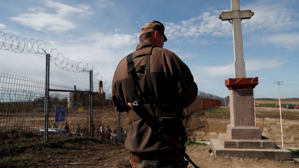 The Wider Image: In Hungary, one fence comes down, another goes up