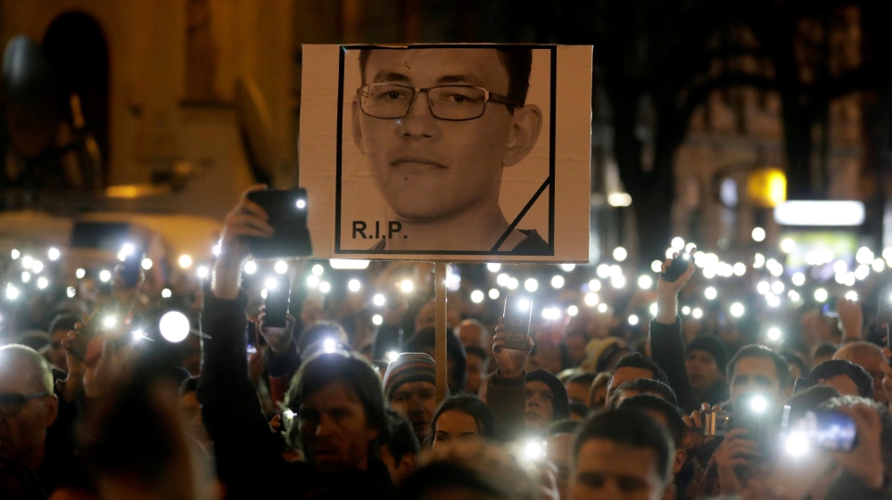 Demonstrators take part in a protest rally marking the first anniversary of the murder of investigative reporter Jan Kuciak and his fiancee Martina Kusnirova in Bratislava, Slovakia on February 21, 2019
