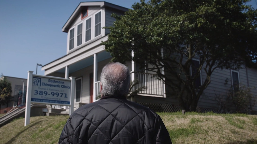 
Cenikor sent Matthew Oates to a private residence to trim trees without safety harness, helmet or rope. He fell, broke his back and still needs to regularly see a chiropractor [Screengrab/Al Jazeera]
