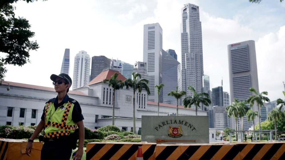 A police officer patrols the area surrounding Singapore''s Parliament House on Friday, Jan. 15, 2016, in Singapore.