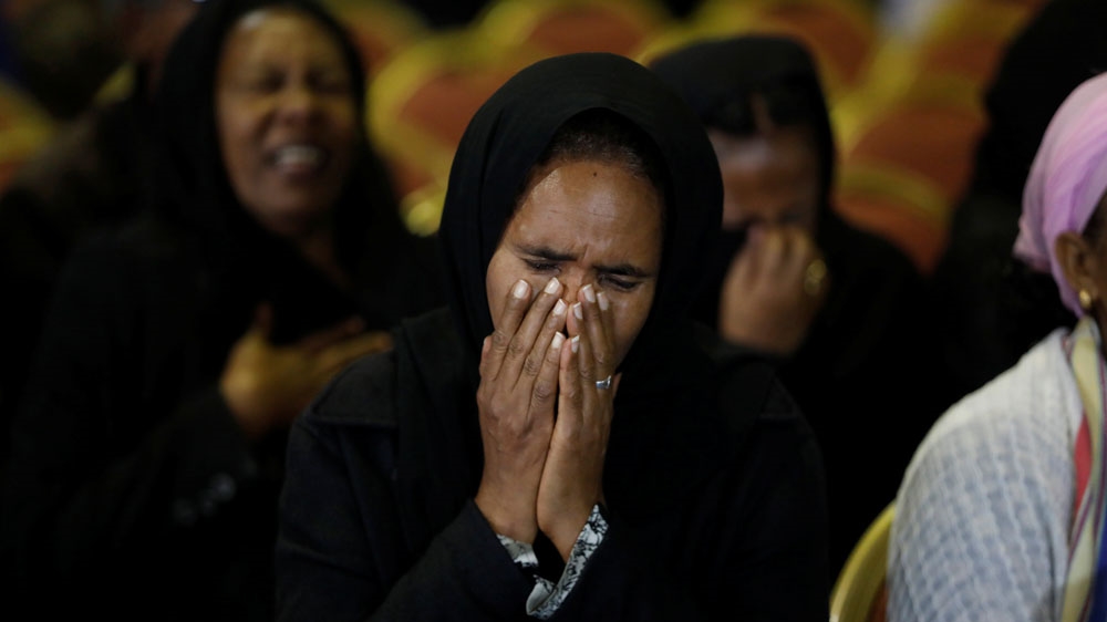 A mourner reacts during the memorial ceremony in Addis Ababa