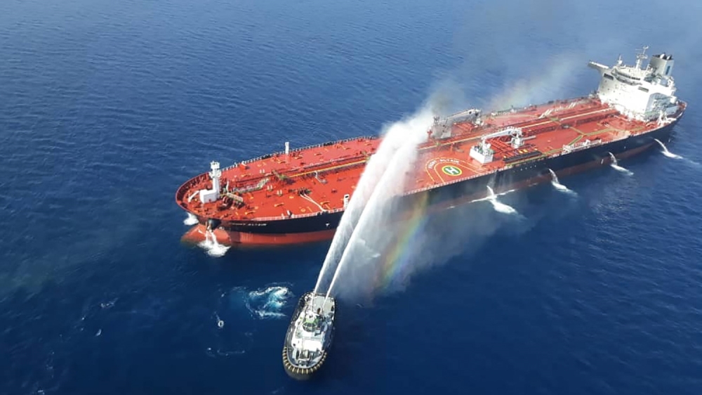 A picture obtained by AFP from Iranian news agency Tasnim on June 13, 2019 reportedly shows an Iranian navy boat trying to control fire from Norwegian owned Front Altair tanker said to have been attac
