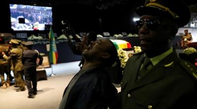 Mourners began wailing and crying out long before proceedings began