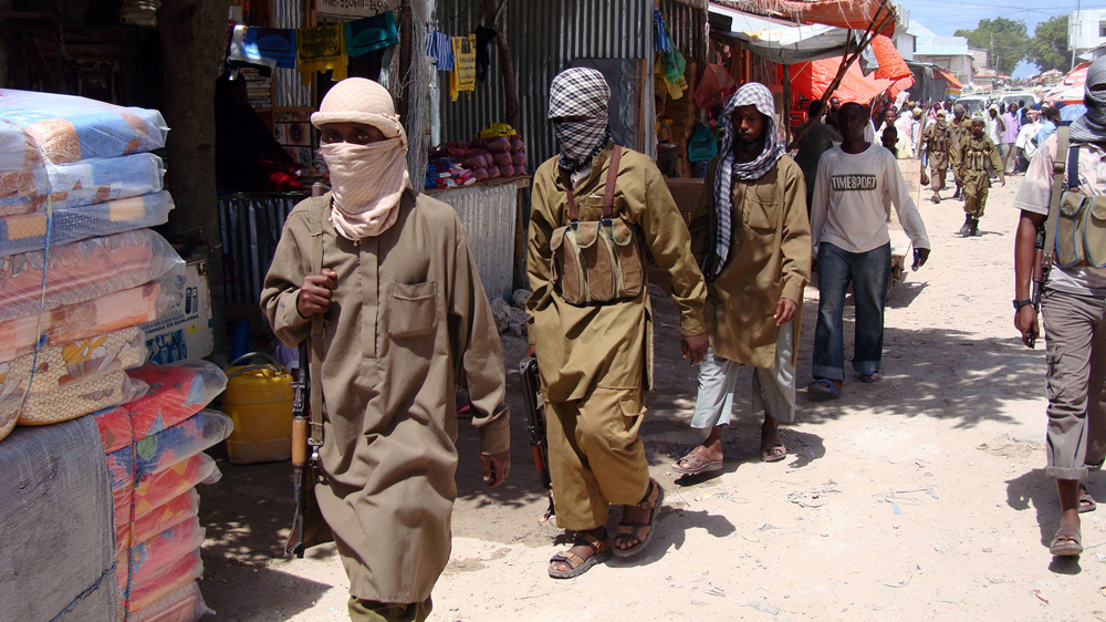 Armed Al-Shabaab fighters on patrol [File: Mohamed Sheikh Nor/AP Photo]