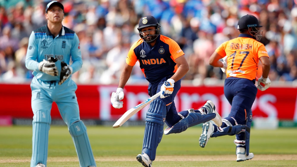 India’s Rohit Sharma and Rishabh Pant in action as England’s Jos Buttler looks on during the ICC Cricket World Cup tournament in Birmingham, UK