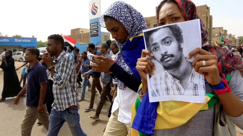 People demonstrate against the killing of protesting children, who were shot dead when security forces broke up a student protest in Khartoum
