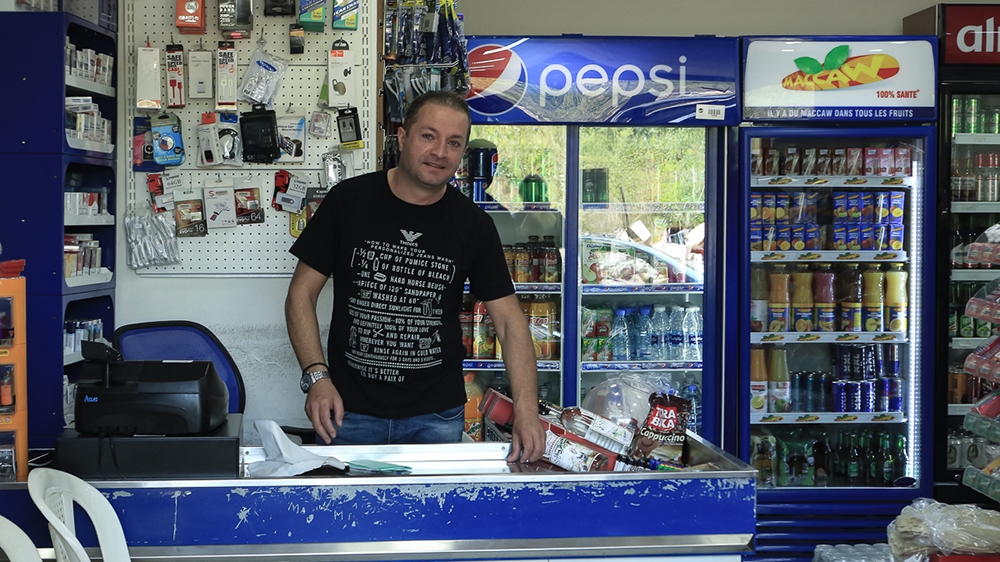 Naji Boulos, a shopkeeper, says most people in the area are opposed to the dam project