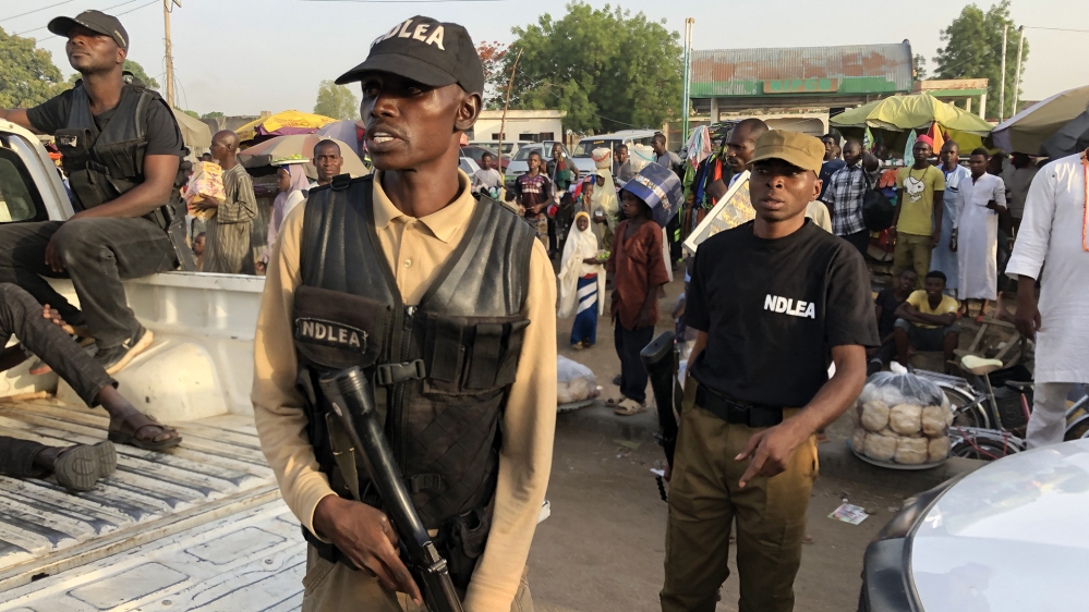 National Drug Law Enforcement Agency (NDLEA) members during a drug raid in Kano