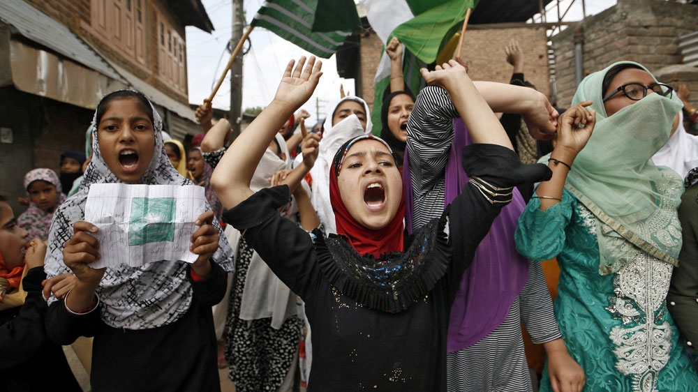 Kashmiris shout slogans during a protest after Friday prayers in Srinagar