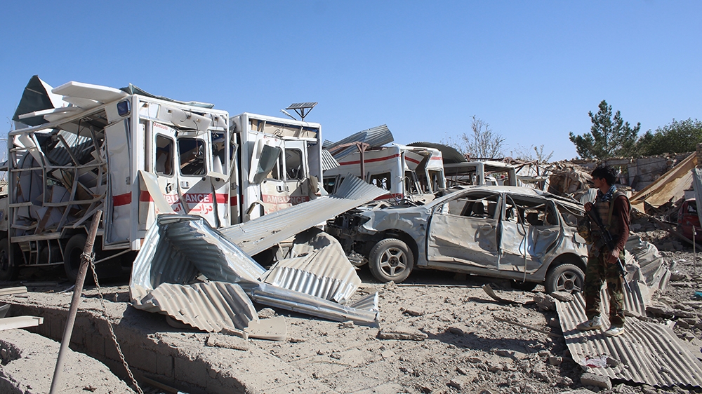 Afghan security forces investigate the site where a Taliban car bomb detonated near an intelligence services building in Qalat in Zabul province on September 19, 2019. - A car bomb attack targeting an