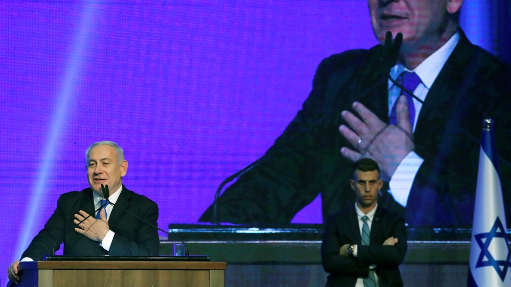 Israeli Prime Minister Benjamin Netanyahu gestures at the Likud party headquarters in Tel Aviv