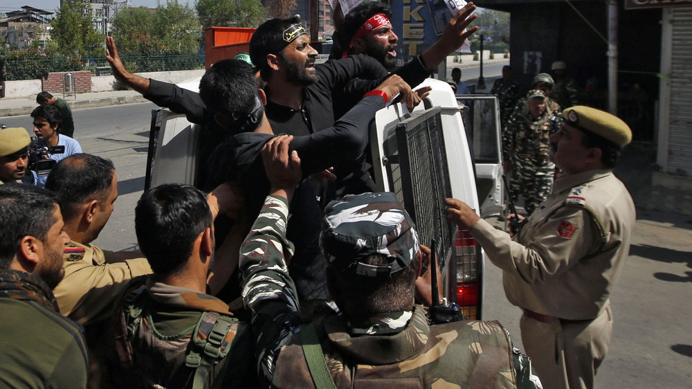 Kashmiri Shia Muslims raise are detained by Indian police while trying to participate in a Muharram procession in Srinagar