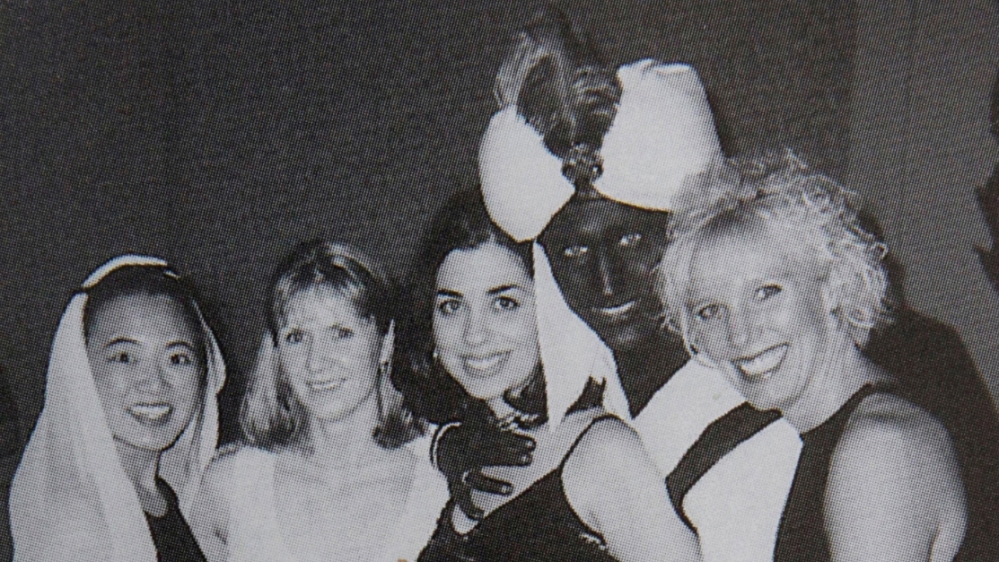 Canada’s Prime Minister Justin Trudeau, with his face and hands painted brown, poses with others during an ‘Arabian Nights’ party when he was a 29-year-old teacher at the West Point Grey Academy in Vancouver, Canada