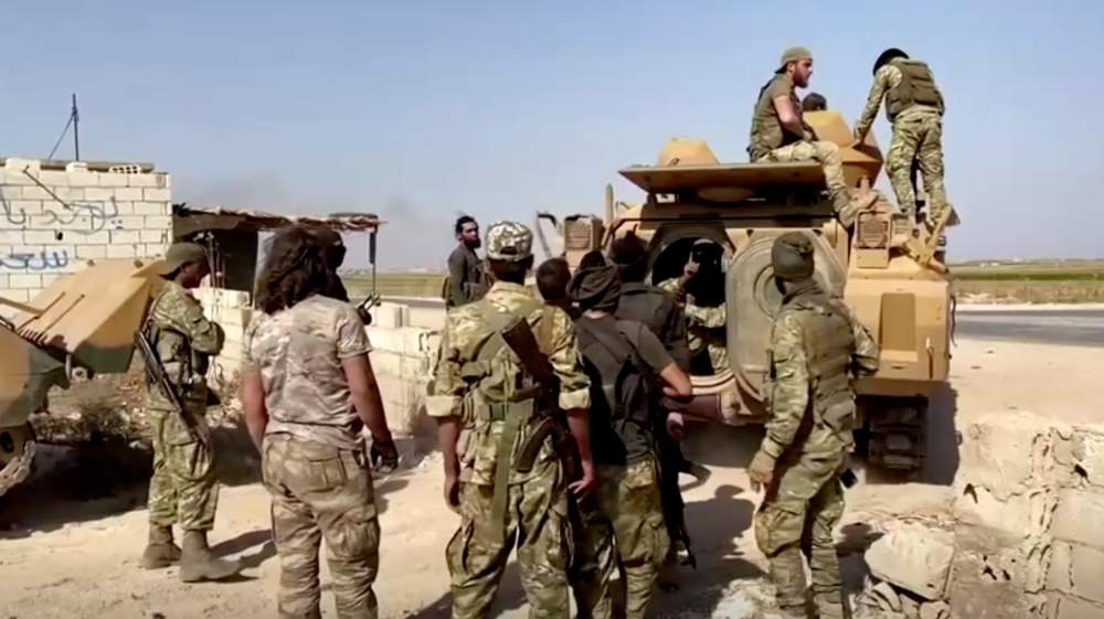 Turkey-backed Syrian rebel soldiers took over city centre of Tel Abyad according to Turkish Anadolu agency [Reuters]