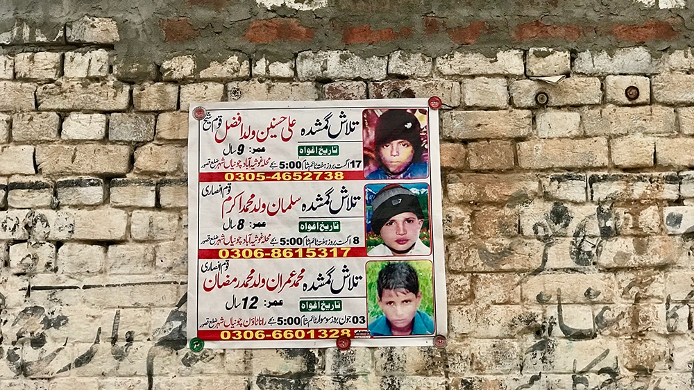 Posters with photos of missing children are still pasted on walls around Chunian, Pakistan, where four boys were found dead after being kidnapped and raped [Zehra Abid/Al Jazeera]