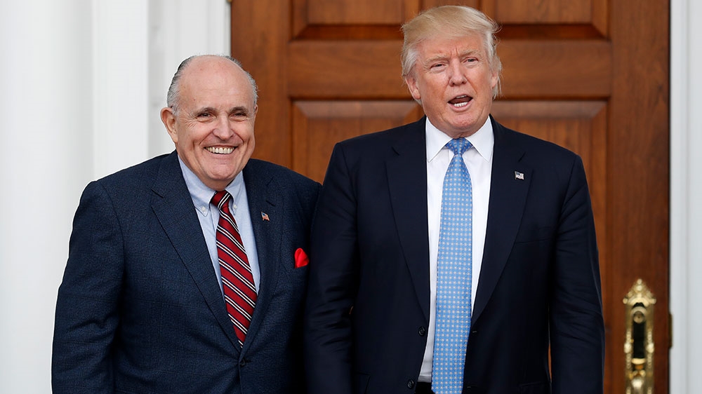 Trump and Giuliani pose for photographs